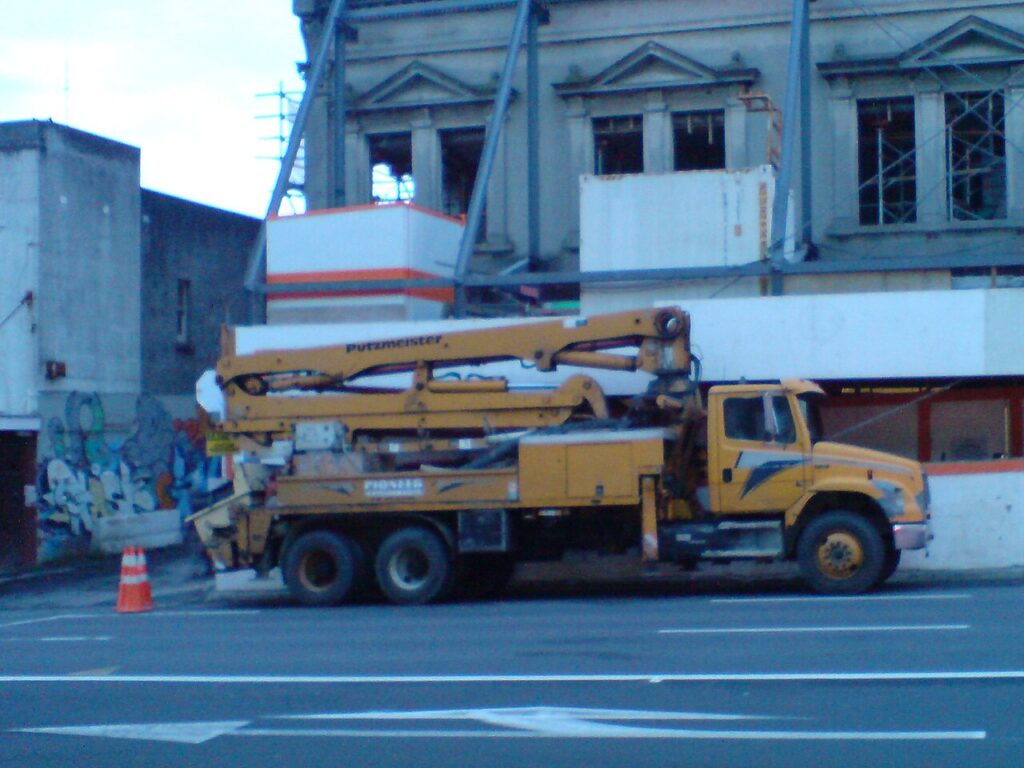 Truck-mounted concrete pump used to illustrate the difference between rated pump output and site production